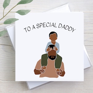 May include: A card with a simple illustration of a father and son. The son is sitting on the father's shoulders. The card says "To a special Daddy".