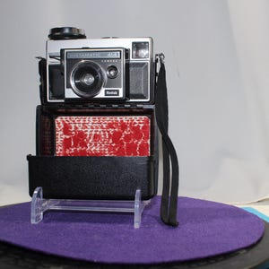 Kodak Instamatic 414 camera in plastic flip case made in 1970s