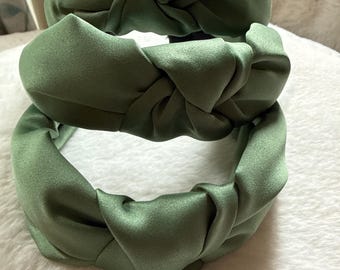 Twisted silky satin covered Alice bands , firm hold and really pretty