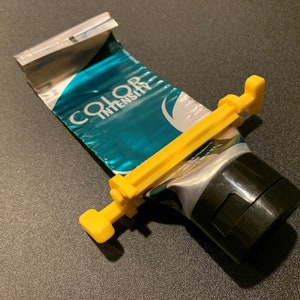 Dispensador de pasta de dientes perezoso con exprimidor rodante