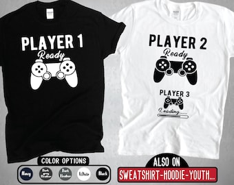 Jugador 1 Jugador 2 Camisas a juego, Esperando al jugador 3, Anuncio de embarazo, Pareja Gamer Sudadera con capucha Camiseta juvenil de manga larga