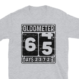 May include: Gray t-shirt with a black and white graphic of an odometer reading 65 days. The graphic has a distressed look.