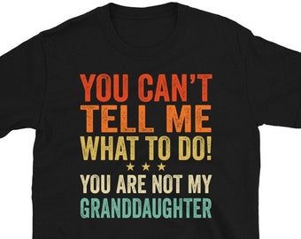 May include: Black t-shirt with a vintage-style graphic that says "You can't tell me what to do! You are not my granddaughter."