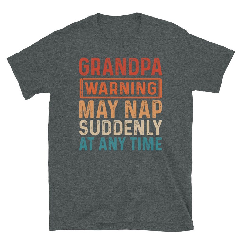 May include: A dark heather grey t-shirt with a vintage-style graphic that reads "Grandpa Warning May Nap Suddenly At Any Time".