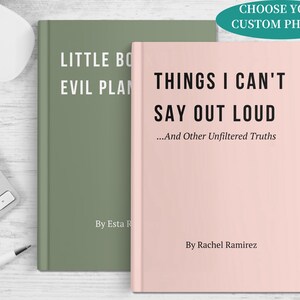 May include: Two hardcover books with text. One is sage green with the title "Little Bo Evil Plan". The other is light pink with the title "Things I Can't Say Out Loud". A pen and keyboard are in the background.