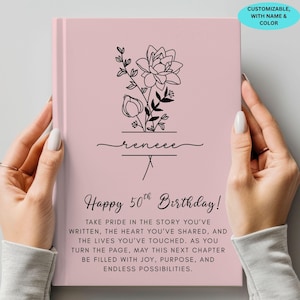 May include: A pink journal with a floral design and the name "renee" in cursive. The text "Happy 50th Birthday!" is below the floral design, along with a personalized message. The journal is customizable with name and color.