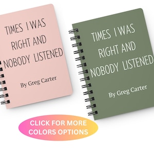 May include: Two spiral bound notebooks with the text "Times I Was Right And Nobody Listened" and "By Greg Carter" on the front covers. The notebook on the left is pink and the notebook on the right is green.