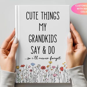 May include: A white journal with black text that reads "Cute Things My Grandkids Say & Do...so I'll Never Forget". The journal is decorated with a border of colorful flowers.