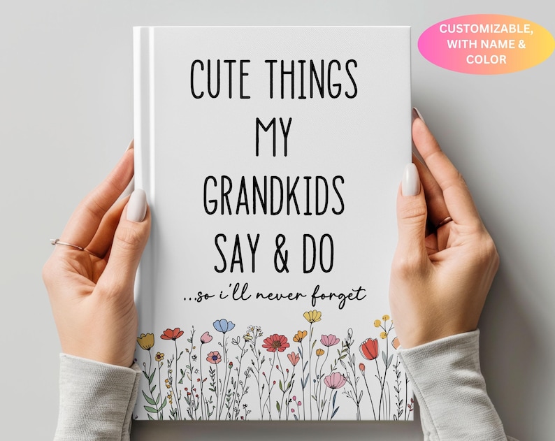 May include: A white journal with black text that reads "Cute Things My Grandkids Say & Do...so I'll Never Forget". The journal is decorated with a border of colorful flowers.
