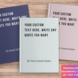 May include: Three hardcover books in navy blue, light blue, and pink, each with the text "YOUR CUSTOM TEXT HERE, WRITE ANY QUOTE YOU WANT." The books are personalized with names and are on a wooden surface.