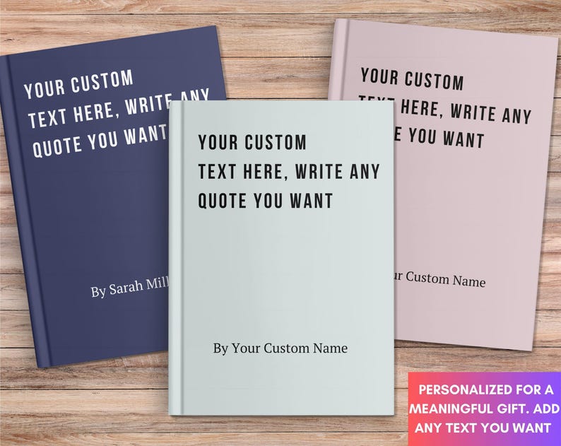May include: Three hardcover books in navy blue, light blue, and pink, each with the text "YOUR CUSTOM TEXT HERE, WRITE ANY QUOTE YOU WANT." The books are personalized with names and are on a wooden surface.