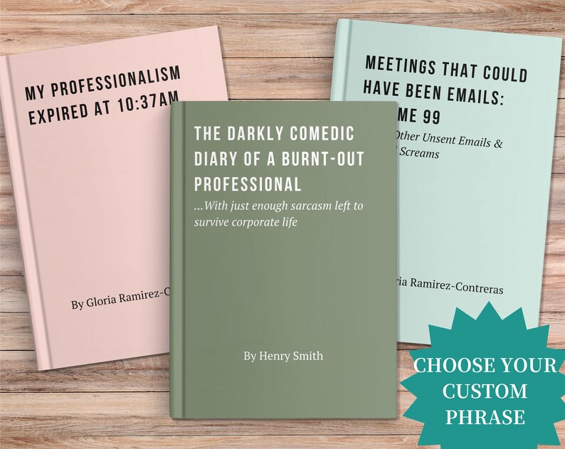May include: Three hardcover books with humorous titles are displayed on a wooden surface. The books are in pastel pink, sage green, and light blue. Text on the books includes "My Professionalism Expired at 10:37AM" and "The Darkly Comedic Diary of a Burnt-Out Professional."