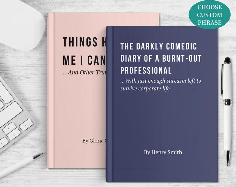 May include: Two hardcover books, one blush pink and one navy blue, are displayed. The pink book's title reads "THINGS H ME I CAN...And Other Truths." The blue book's title is "THE DARKLY COMEDIC DIARY OF A BURNT-OUT PROFESSIONAL...With just enough sarcasm left to survive corporate life."