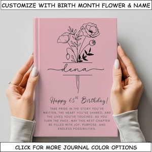 May include: A pink journal with a floral design and the name "dena" in script. The text reads "Happy 65th Birthday!" and includes a personalized message. The top of the journal has the text "CUSTOMIZE WITH BIRTH MONTH FLOWER & NAME".