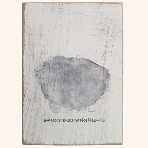 May include: A gray and white abstract painting of a creature with a text inscription at the bottom that reads "U-LA-H-T-O-X-A-E-V-U-G-N-I-H".