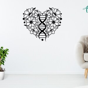 May include: Black and white wall decal of a heart shape made of flowers with a DNA strand in the center. The decal is on a white wall with a potted plant and a couch in the background.