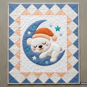 May include: A rectangular quilt featuring a white center panel with a sleeping white bear wearing an orange cap on a blue crescent moon, surrounded by blue and white stars. The border has a geometric pattern in blue, white, and peach, 36" x 42".