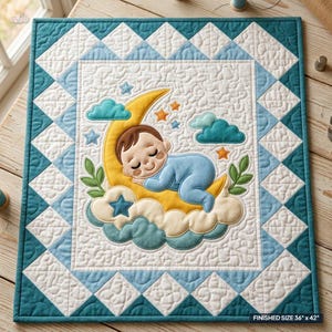 May include: A rectangular quilt featuring a central applique of a baby sleeping on a yellow crescent moon surrounded by blue clouds, stars, and green leaves. The border consists of white and blue triangles. The text reads: FINISHED SIZE 91 cm x 107 cm.