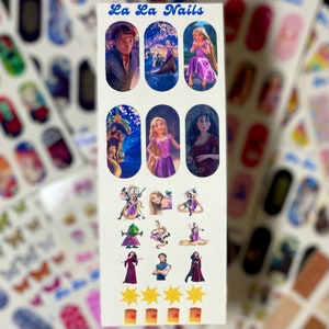 May include: A sheet of nail decals featuring characters from the Disney film Tangled. The decals include Rapunzel, Flynn Rider, Mother Gothel, and Pascal the chameleon. The sheet also includes a few lanterns and stars.