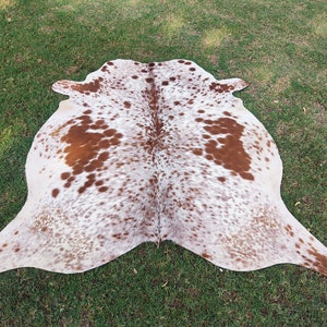 Matta i äkta kohud Brun och vit kohud Brasiliansk kohud Salt- och pepparmatta Kohud med hår på huden Spräcklig kohud bild 9