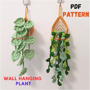 May include: Two crocheted wall hanging plants, one in a round pot and one in a teardrop shape. Both plants have green leaves and are hanging from a white wall. The text "PDF PATTERN" is in the top right corner of the image. The text "WALL HANGING PLANT" is in the bottom left corner of the image.