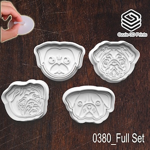May include: Four white plastic pug-shaped cookie cutters. Each cutter displays a different pug face design. The text "0380_Full Set" is at the bottom. The logo "Ozzie 3D Prints" is in the upper right corner.