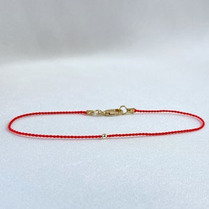 14k Gold Bead Red String Bracelet: Kabbalah Jewelry