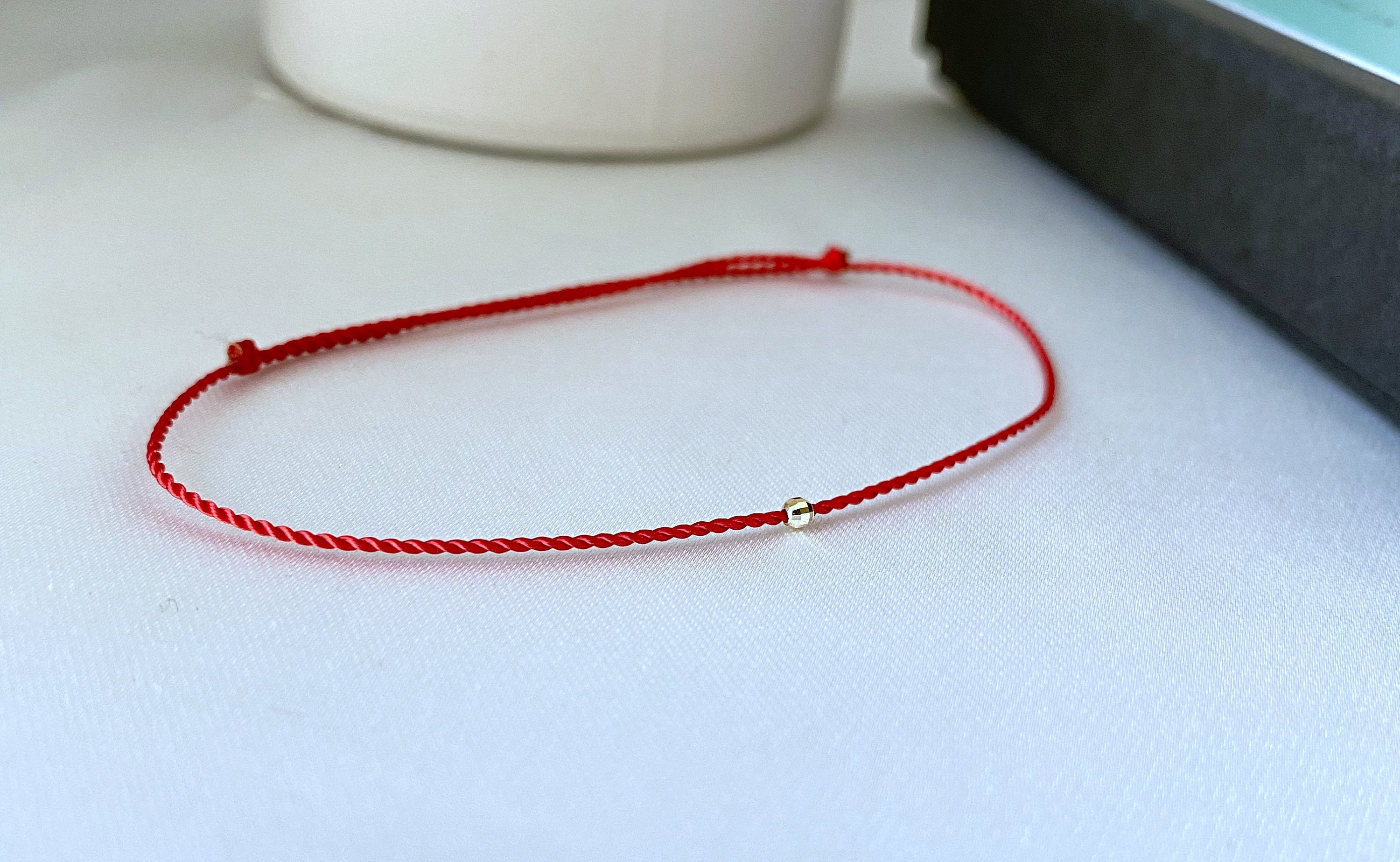 Thin red hotsell string bracelet