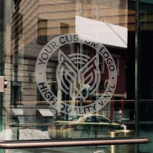 May include: A glass door with a frosted sticker that says "Your Custom Logo High Quality Vinyl". The sticker is a circle with a stylized wolf design inside.