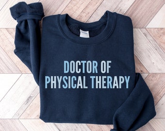 May include: A navy blue sweatshirt with the text "DOCTOR OF PHYSICAL THERAPY" printed in light blue on the front.