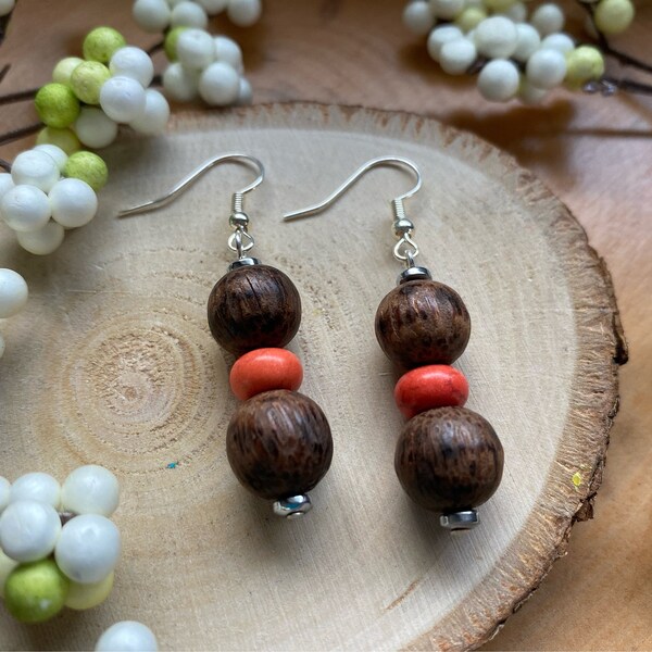 Brown and orange bead earrings with silver plated accents.