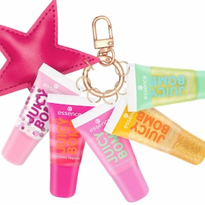 May include: A keyring featuring a bright pink star-shaped charm and five small tubes of Essence Juicy Bomb lip gloss in various colours including light pink, dark pink, yellow, and light green, all attached to a gold-toned metal ring.