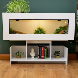 May include: A set of three ceramic nesting bowls in graduating sizes. The bowls are white with a speckled, textured finish and feature a simple, modern design. Ideal for food prep or serving.