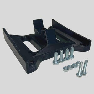 May include: A black 3D printed plastic base with a raised section and a slot. The base is accompanied by eight silver screws and nuts.