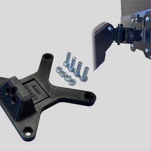 May include: Black plastic monitor mount with a swivel arm and screws. The mount has the text "keep steady" printed on it.