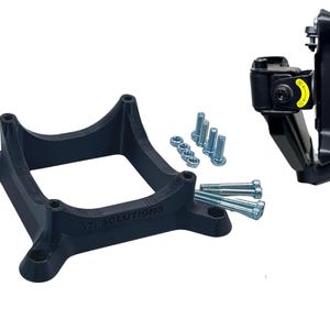 May include: A black plastic mounting bracket with a square base and a curved top. The bracket has the text "718 SOLUTIONS" printed on it. The image also shows a black metal bracket with a yellow warning label and a set of silver screws.