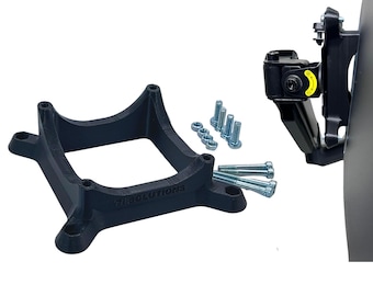 May include: A black plastic mounting bracket with a square base and a curved top. The bracket has the text "718 SOLUTIONS" printed on it. The image also shows a black metal bracket with a yellow warning label and a set of silver screws.