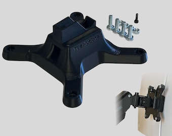 May include: Black 3D printed base with a slot for a monitor arm. The base has four legs and the text "TI Solutions" is printed on the side. The base comes with screws and nuts for mounting.