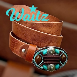 May include: A brown leather belt with a silver and turquoise beaded buckle. The buckle features a star design and turquoise stones.