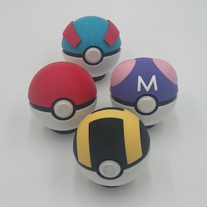 May include: Four Poke Balls with different colors and designs. The Poke Balls are red, blue, purple, and yellow with black stripes. The Poke Balls have a white center with a small black button.