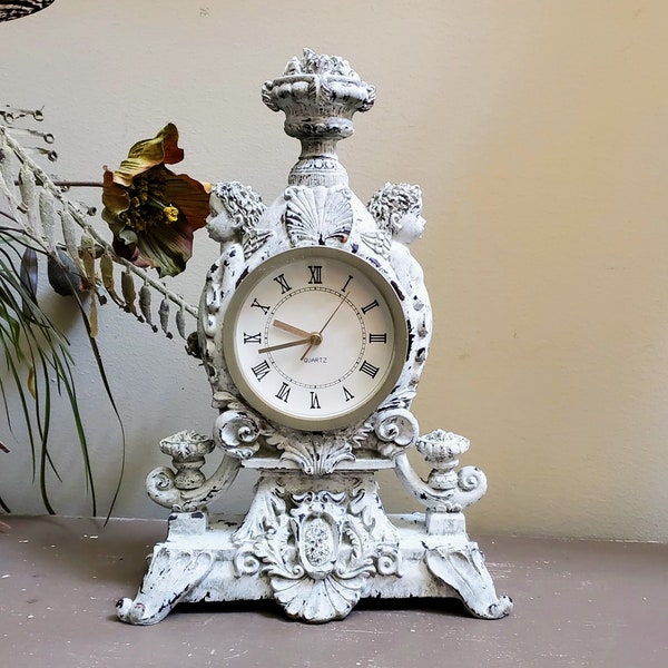 Cherub Mantle Clock Ornately Carved Putti Flank French Empire Styling Lush Timepiece Elegant Statement Cast