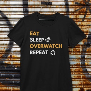 Overwatch 2 | Eat Sleep Overwatch Repeat T-Shirt | Gaming T-Shirt | Black Unisex T-Shirt | Perfect Gift for Gamers and Overwatch Fans