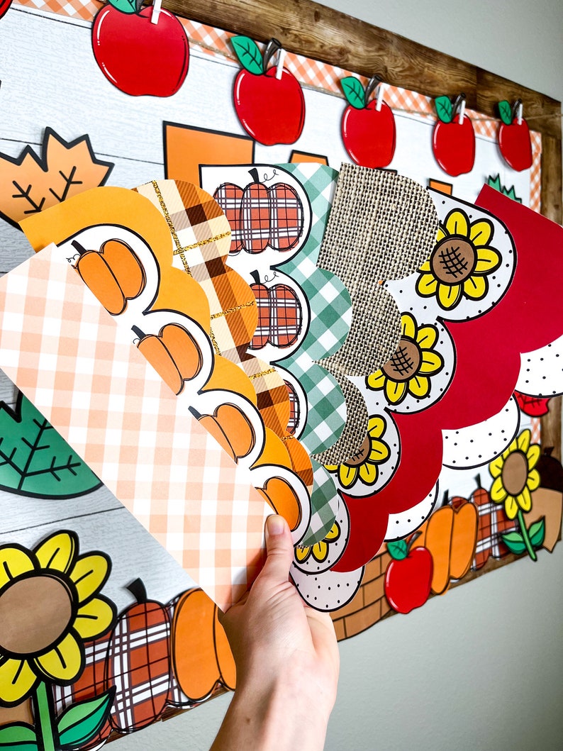 May include: A set of fall-themed classroom decorations featuring a variety of patterns, including plaid, gingham, and polka dots. The decorations include pumpkins, sunflowers, and apples in shades of orange, yellow, red, and green.
