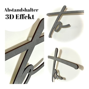May include: A close-up of a wooden "to" sign with a 3D effect. The sign is made of two pieces of wood that are layered on top of each other. The text "Abstandshalter 3D Effekt" is visible in the top left corner of the image.