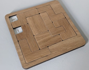 May include: A wooden calendar with a sliding puzzle design. The calendar is set to January 1st.