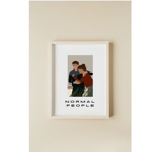 May include: A framed print of a couple embracing, with the text "NORMAL PEOPLE" below the image.