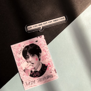 May include: A handmade ceramic mug with a speckled, cream-coloured glaze. The mug has a wide, rounded body and a sturdy handle. The interior is a darker, contrasting shade. Ideal for tea or coffee.