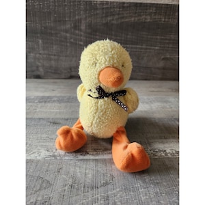 Regalo per bambini di peluche con anatra gialla di Carter