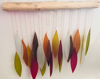 Bamboo Habitat hand made recycled glass wind chimes with drift wood style hanger in Sunset tones.