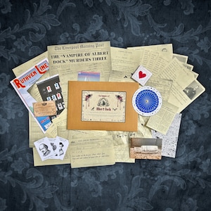 May include: A collection of vintage-style papers and ephemera, including a newspaper headline that reads "The "Vampire of Albert Dock" Murders Three", a map, a compass, and a card with a red heart. The papers are arranged on a dark blue background with a floral pattern.
